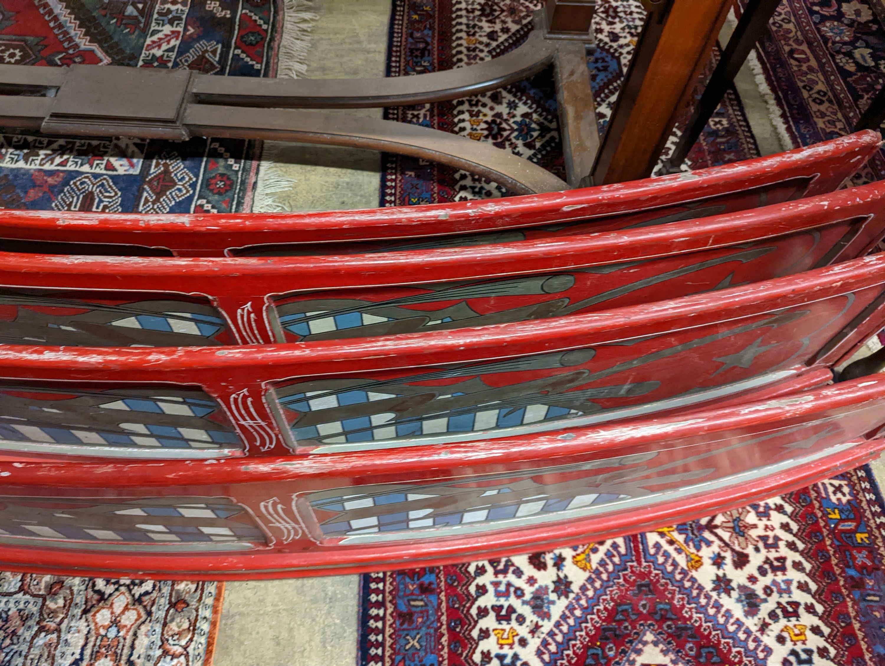 Four vintage painted fairground boards. Length-183cm, Height-39cm.